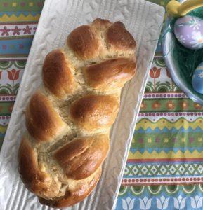 A white tray with a loaf of Italian Easter Bread