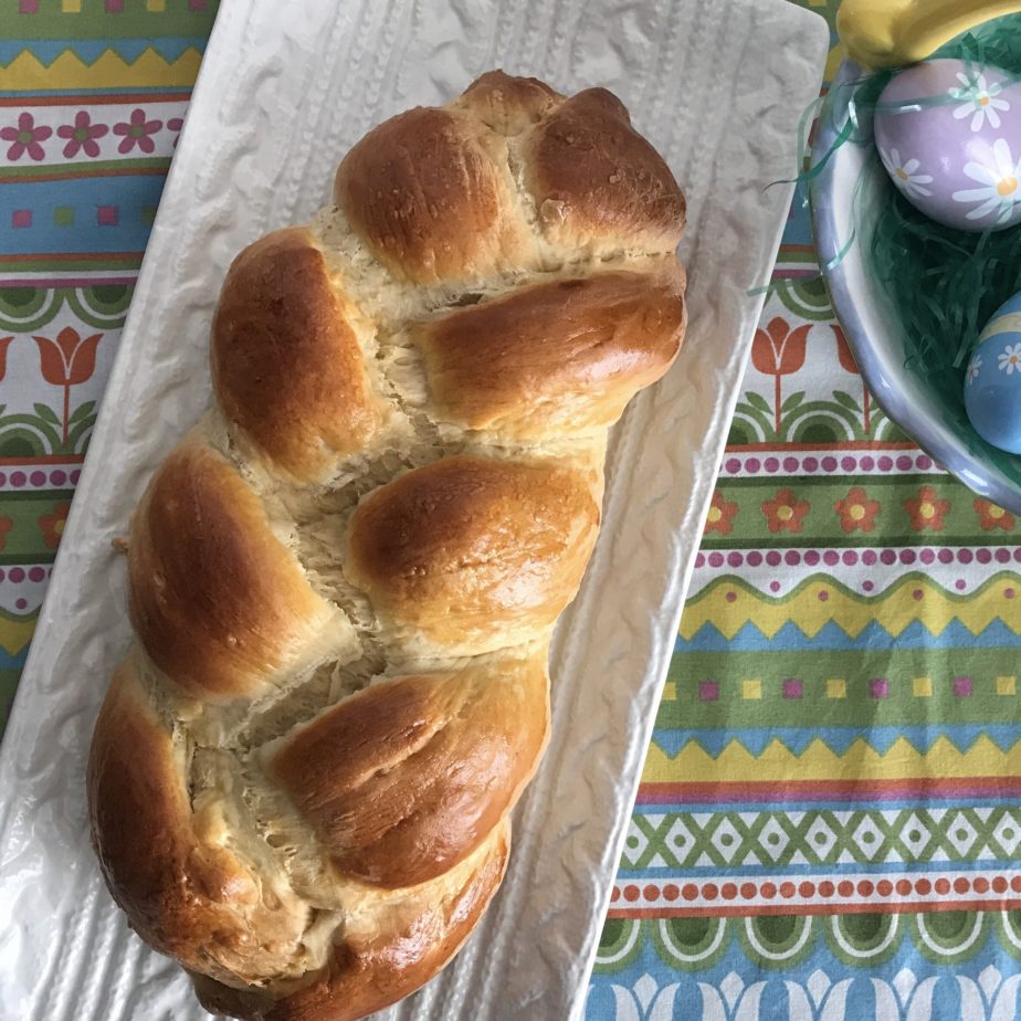 A white tray with a loaf of Italian Easter Bread