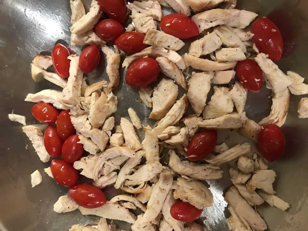 Chicken and tomatoes cooking for a quick and easy weeknight dinner