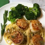 Scallops in a lemon sauce over pasta