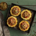 A tray of stuffed acorn squash