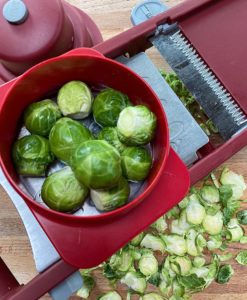 Slicing raw Brussel sprouts