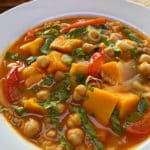 A white bowl filled with Thai Red Curry Soup