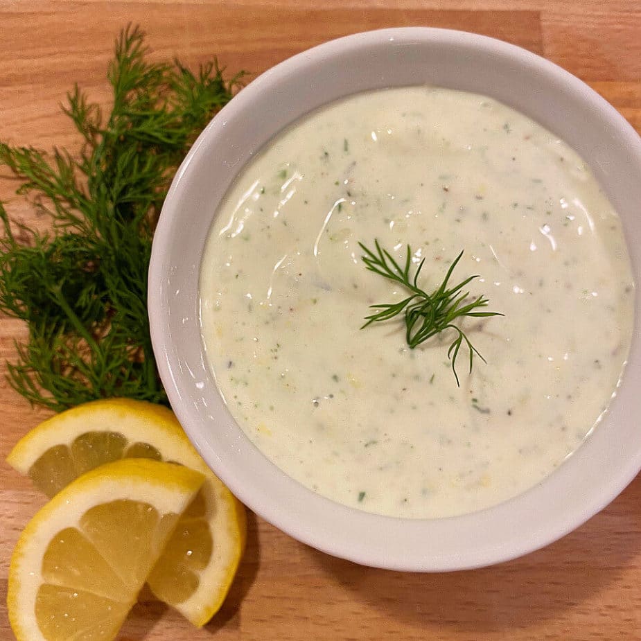 A dish of creamy lemon dill sauce