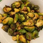 Bowl of roasted brussel sprouts with walnuts