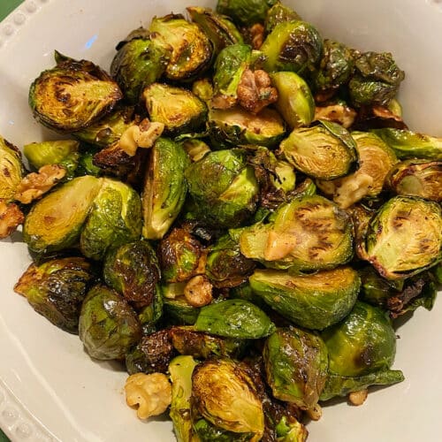 Bowl of roasted brussel sprouts with walnuts