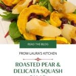 Roasted pears and delicata squash over power greens on a white platter