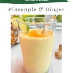 Pineapple and Ginger smoothie on a white counter overlooking a bright, sunny yard.