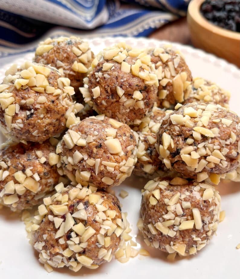 Blueberry Almond Energy Bites piled on a white plate