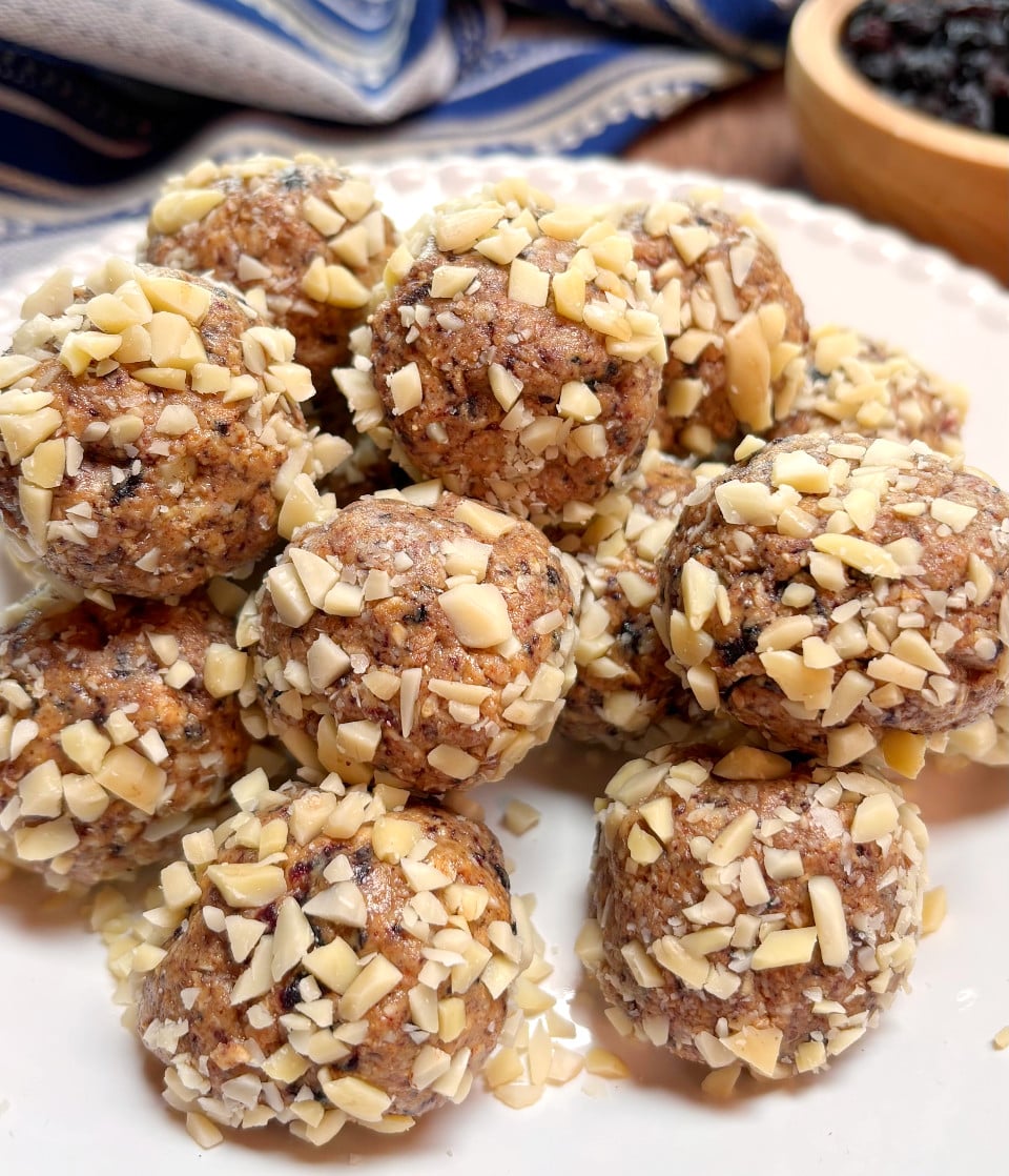 Blueberry Almond Energy Bites piled on a white plate