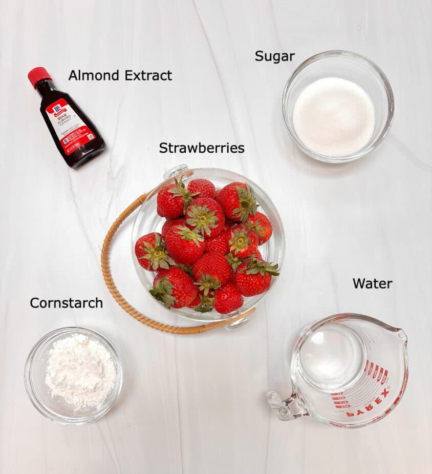 Ingredients used to make the strawberry pie filling on a marble counter