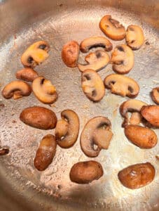 Mushrooms browning on stove top