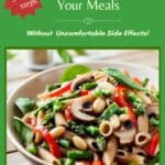 A bowl of whole grain pasta with beans and vegetables on a wood picnic table