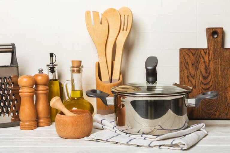 A counter full of various kitchen tools