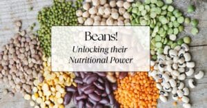 A variety of beans on a board with the title "Beans! Unlocking their Nutrition Power" over top