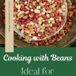 A metal colandar filled with a variety of beans of different colors that spill over into a glass bowl. "Cooking with Beans: Ideal for Meal Prepping" is below the picture.