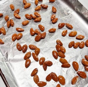 A sheet pan of roasted hot honey almonds.