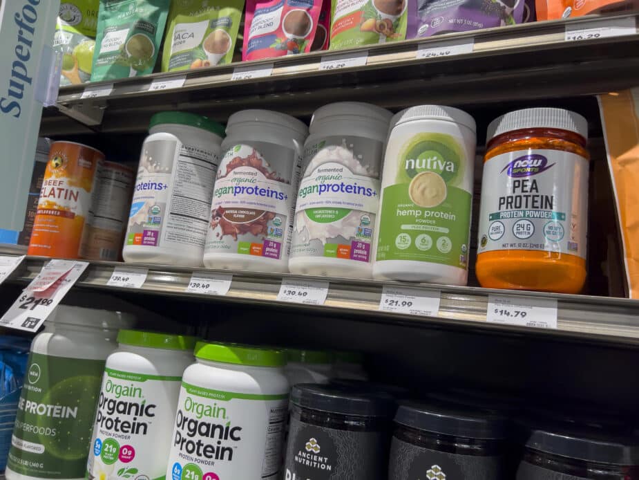 choosing a protein powder a variety of protein powders on a grocery store shelf