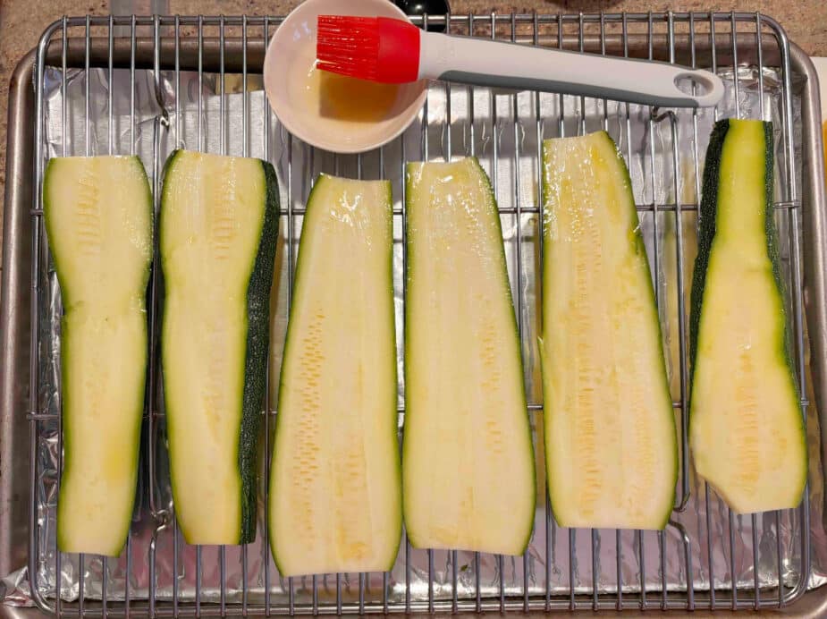 Zucchini with EVOO Sliced zucchini brushed with olive oil